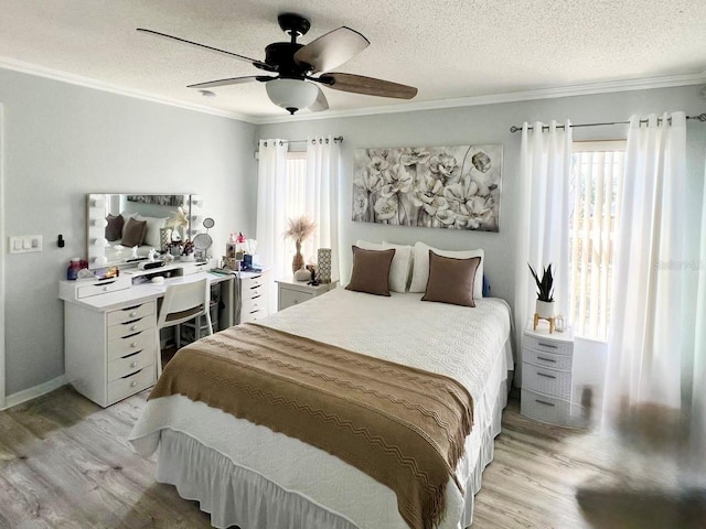 bedroom with crown molding, a textured ceiling, and light wood-type flooring