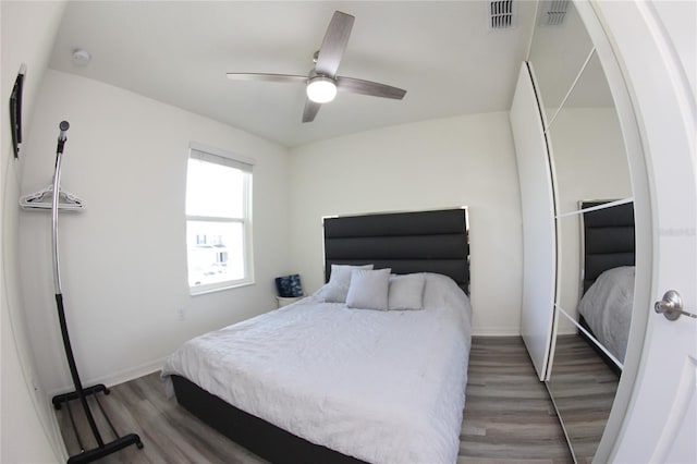 bedroom featuring wood-type flooring and ceiling fan