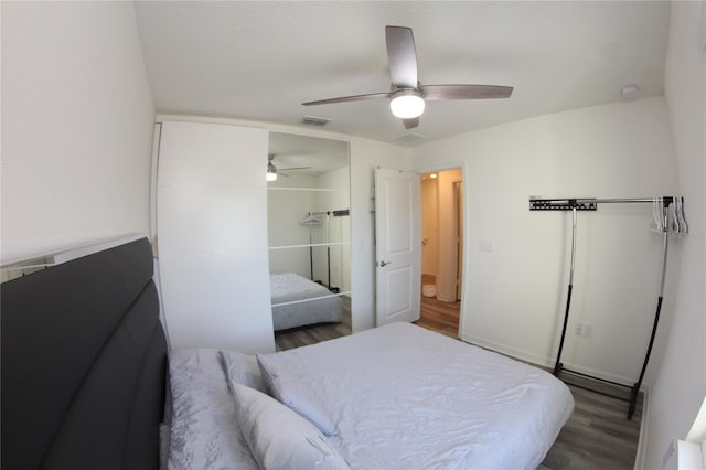 bedroom featuring wood-type flooring, a closet, and ceiling fan