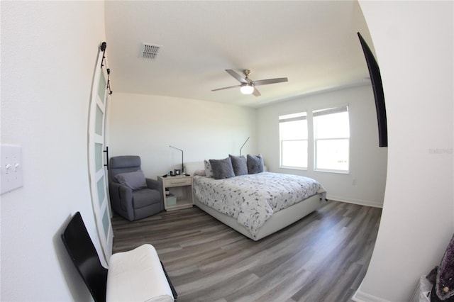 bedroom with hardwood / wood-style flooring and ceiling fan