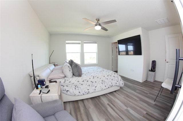 bedroom featuring hardwood / wood-style flooring and ceiling fan