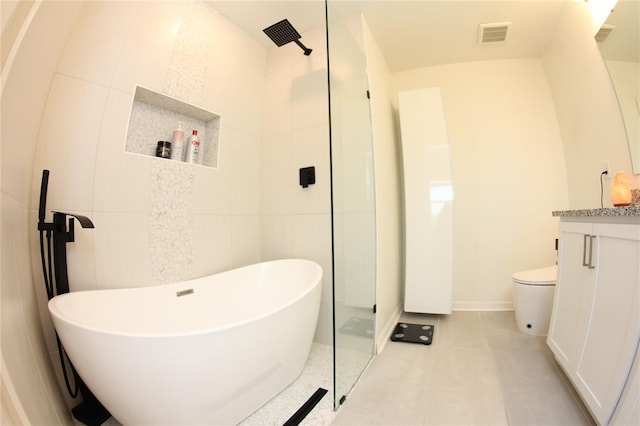 full bathroom featuring tile patterned floors, toilet, separate shower and tub, tile walls, and vanity