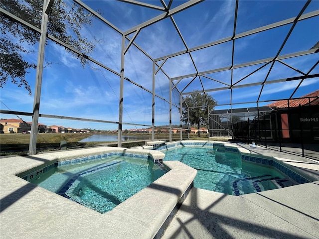 view of swimming pool featuring a water view, an in ground hot tub, a lanai, and a patio