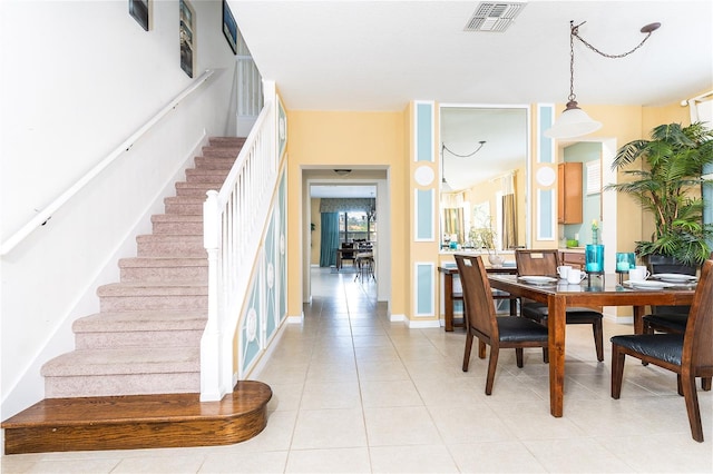 dining space with light tile patterned flooring