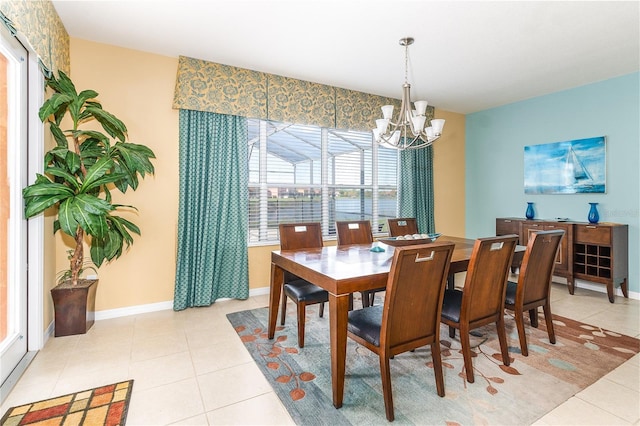 tiled dining space featuring a notable chandelier