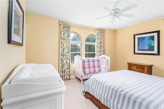 carpeted bedroom with ceiling fan