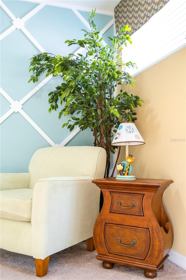 living area featuring light carpet