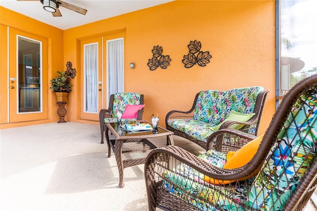 view of patio / terrace with an outdoor living space and ceiling fan