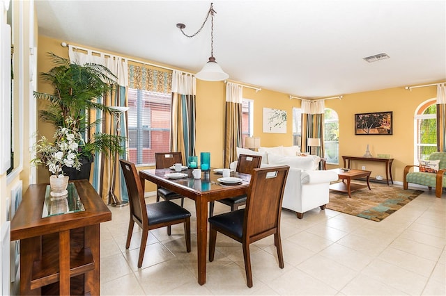 dining space with light tile patterned floors