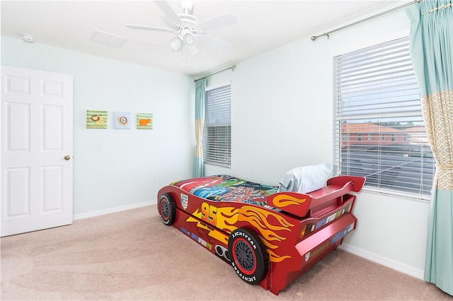 bedroom with ceiling fan and light colored carpet