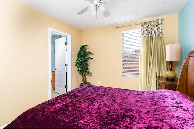 bedroom featuring ceiling fan and connected bathroom