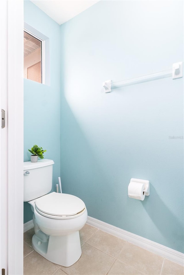 bathroom featuring tile patterned floors and toilet