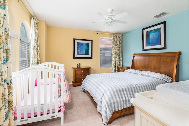 carpeted bedroom featuring ceiling fan