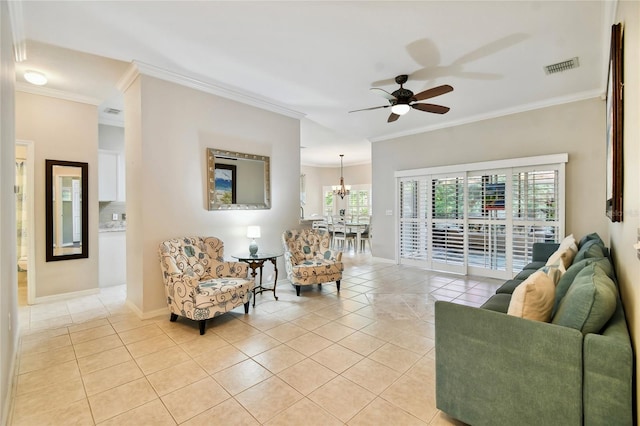 tiled living room featuring ceiling fan with notable chandelier and ornamental molding