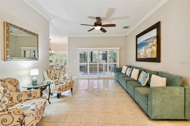 tiled living room with crown molding and ceiling fan with notable chandelier