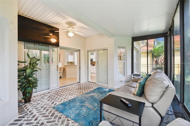 sunroom / solarium with ceiling fan