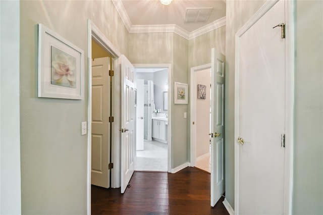 hall featuring crown molding and dark wood-type flooring