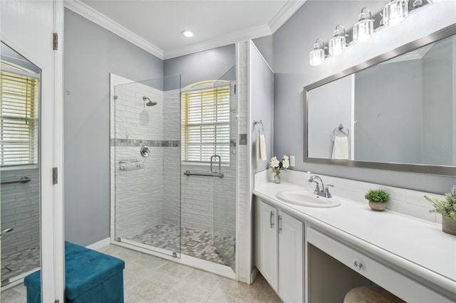 bathroom featuring an enclosed shower, vanity, and crown molding