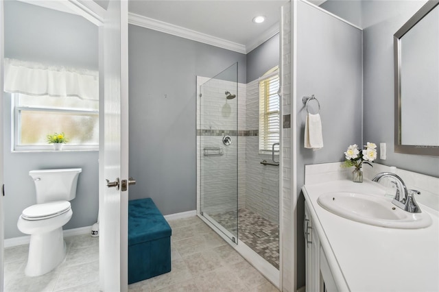 bathroom with vanity, crown molding, toilet, and tiled shower