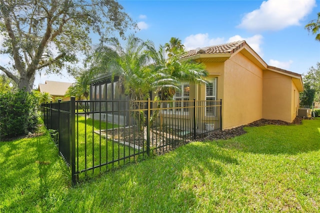 view of side of property featuring a yard