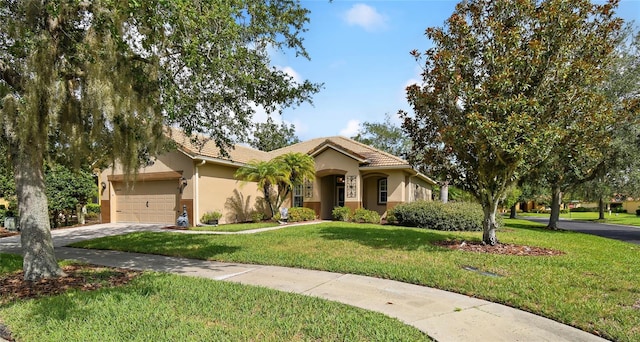 view of front of home featuring a garage and a front lawn