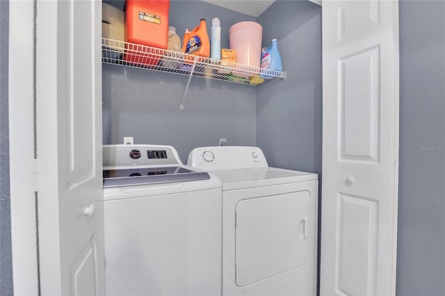 laundry area with separate washer and dryer