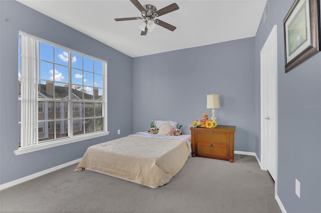 bedroom with ceiling fan and carpet