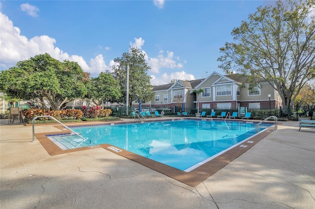 view of swimming pool with a patio area