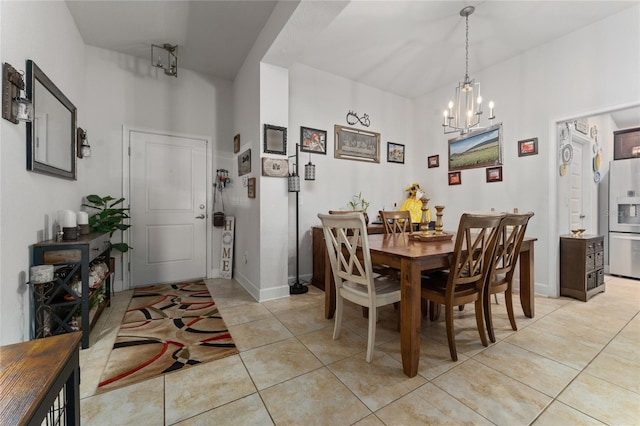 dining area with a notable chandelier and light tile patterned floors