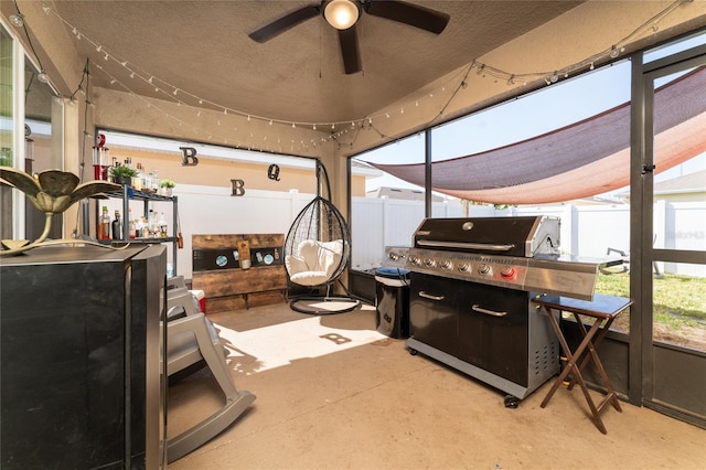 sunroom / solarium with a patio area and an outdoor bar