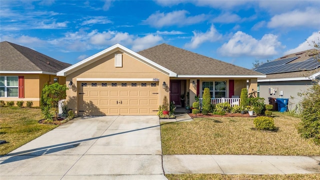 ranch-style home with covered porch, a front yard, and a garage