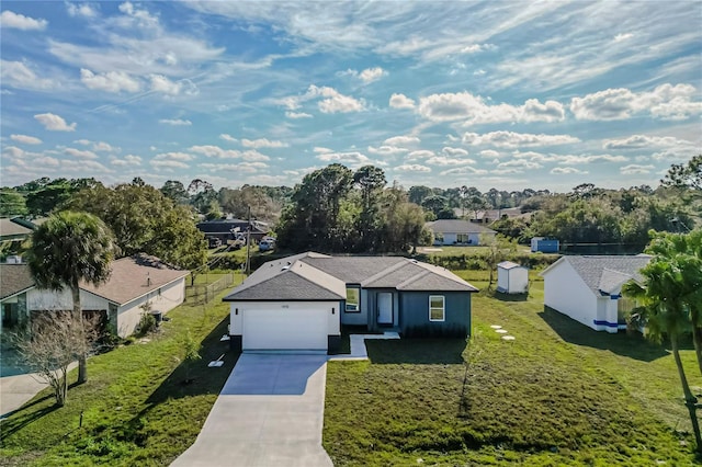 view of front of house with a garage and a front yard