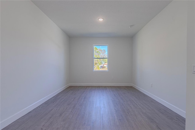 spare room featuring hardwood / wood-style floors