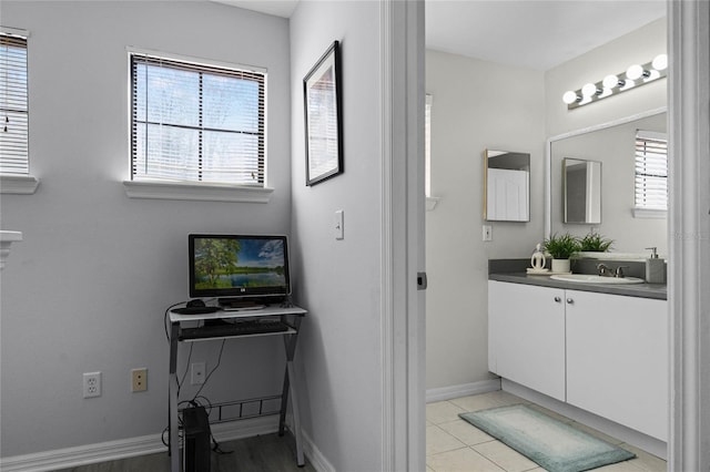 bathroom featuring vanity, tile patterned flooring, and a wealth of natural light