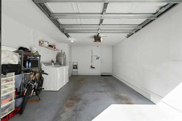 garage featuring a garage door opener, electric water heater, and independent washer and dryer