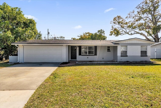 ranch-style house featuring a garage and a front yard