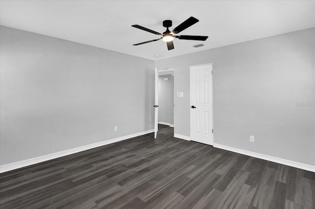 unfurnished bedroom featuring ceiling fan and dark hardwood / wood-style flooring