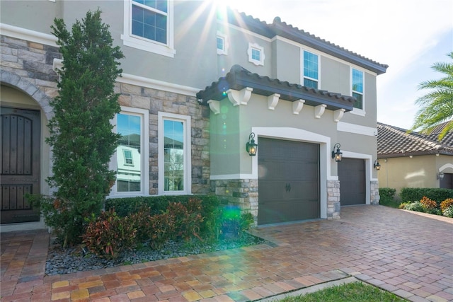 mediterranean / spanish house with a garage