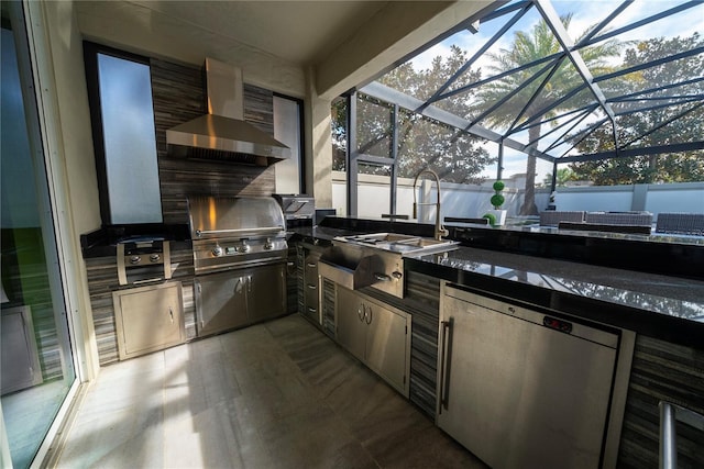 view of patio with an outdoor kitchen, a grill, and glass enclosure