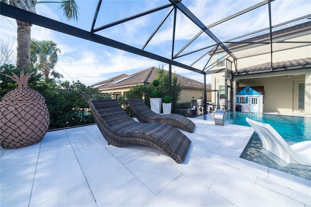 view of patio / terrace featuring a lanai