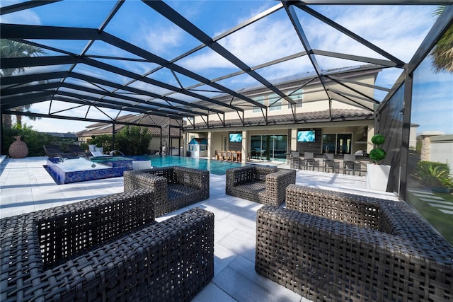 view of patio / terrace featuring an outdoor hangout area, a pool with hot tub, an outdoor bar, and a lanai