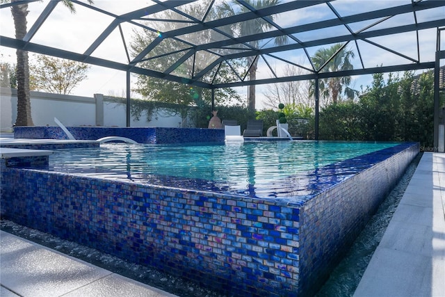 view of pool with pool water feature and a lanai