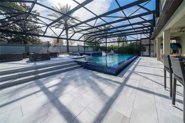 view of pool featuring an outdoor living space, a lanai, a patio area, and ceiling fan