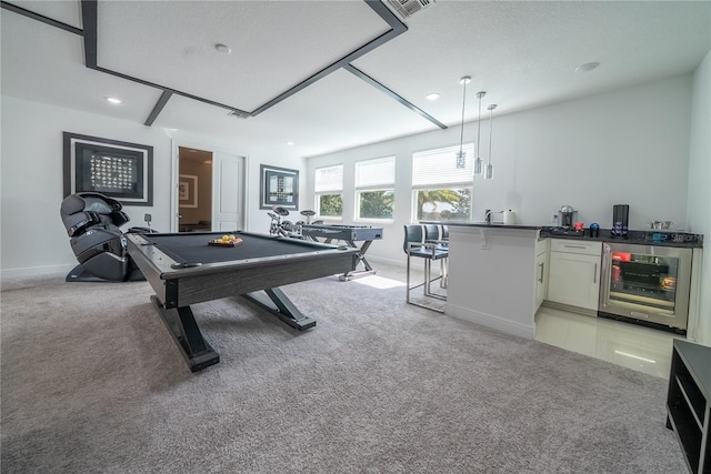 recreation room featuring pool table, light colored carpet, beverage cooler, and bar area