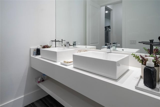 bathroom featuring vanity and hardwood / wood-style floors