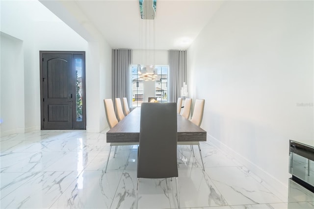 dining space featuring an inviting chandelier