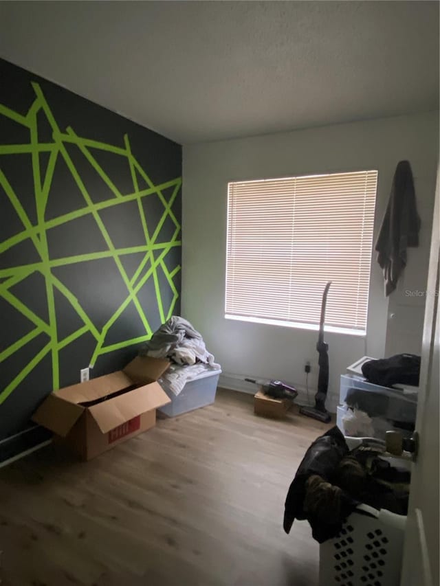 bedroom featuring wood-type flooring