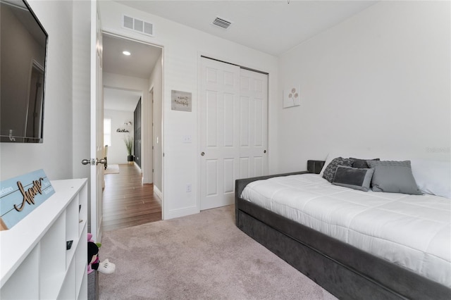 carpeted bedroom featuring a closet