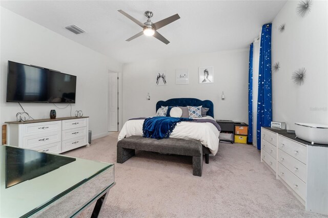 bedroom featuring ceiling fan and light colored carpet