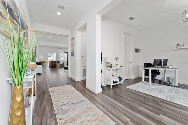 entryway with dark hardwood / wood-style flooring and ceiling fan